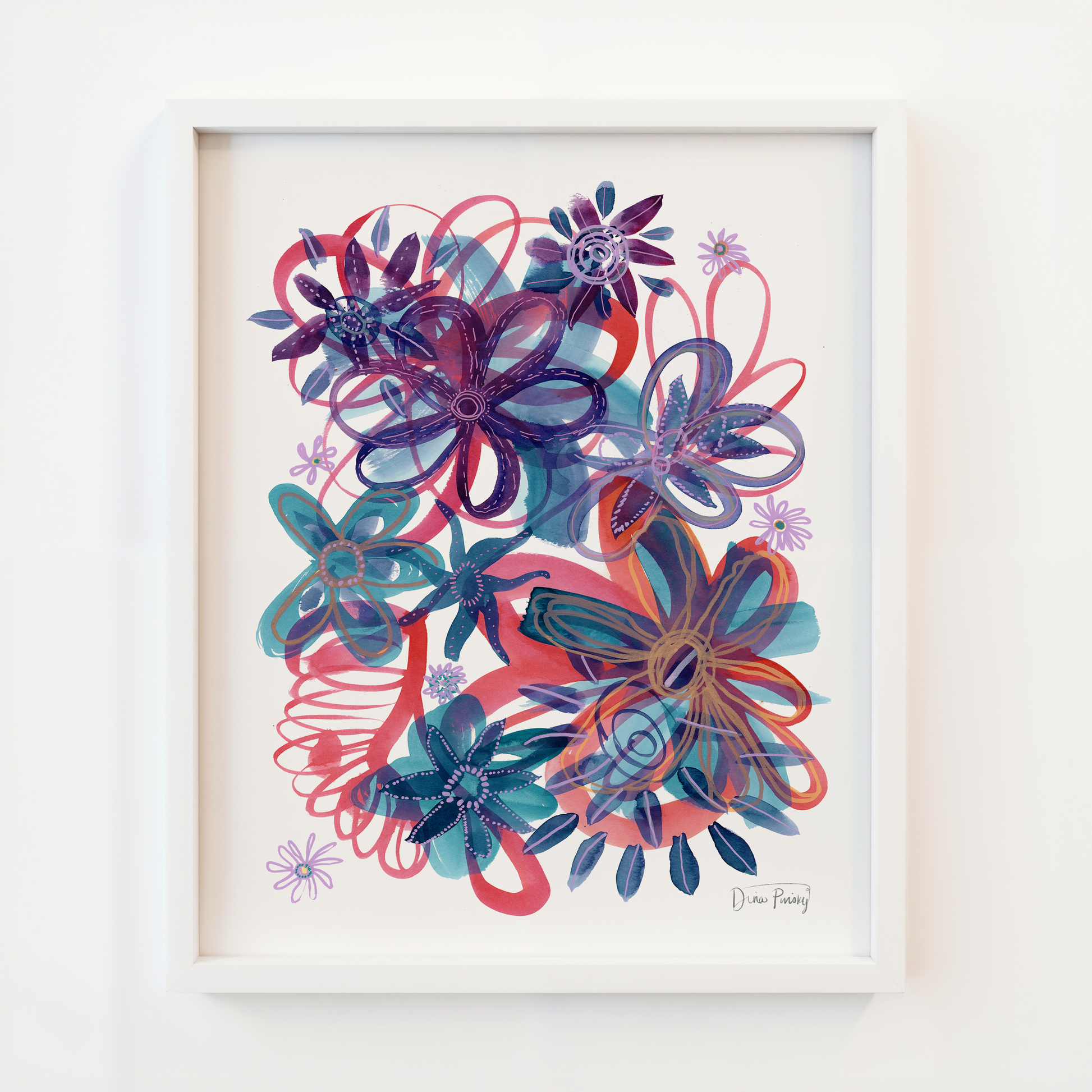 A framed abstract floral art print featuring layered stylized flowers in shades of purple, blue, teal, and coral red on a white background, enclosed in a white frame and mounted on a white wall.
