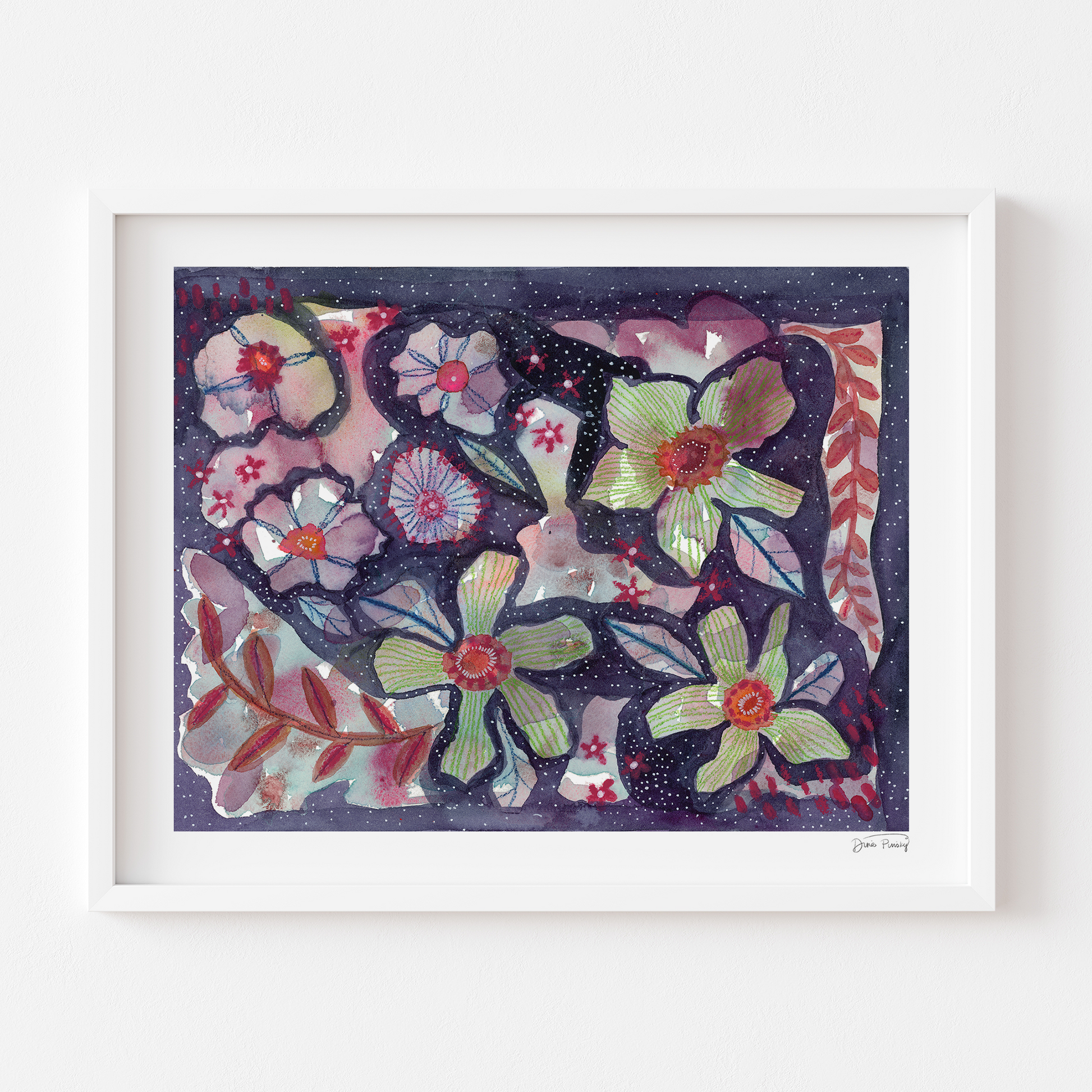 A framed floral art print featuring a dark navy background with pink, green, and red flowers, housed in a white frame and mounted on a white wall.